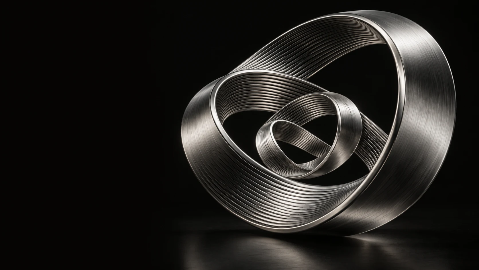 Conceptual platinum sculpture with nested continuous ribbons folding back into one another